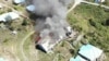 Barak pemuda dan olahraga di Kampung Mamba Kabupaten Intan Jaya, Papua, yang dibakar Kelompok Kriminal Bersenjata (KKB). Selasa 16 Agustus 2022. (Courtesy: Polda Papua)