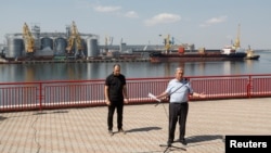 U.N. Secretary-General Antonio Guterres, right, and Ukrainian Infrastructure Minister Oleksandr Kubrakov attend a news briefing in the sea port in Odesa, where grain exports have begun again after Russia and Ukraine signed an export deal in July.