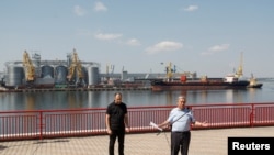 U.N. Secretary-General Antonio Guterres, right, and Ukrainian Infrastructure Minister Oleksandr Kubrakov attend a news briefing in the sea port in Odesa, where grain exports have begun again after Russia and Ukraine signed an export deal in July.