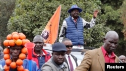 Kenya's opposition leader and presidential candidate Raila Odinga, of the Azimio La Umoja (Declaration of Unity) One Kenya Alliance, waves to his supporters after he filed a petition challenging the presidential election result at the Supreme Court in Nai