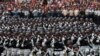 FILE - Members of Mexico's National Guard march in the Independence Day military parade, in the capital's main plaza, the Zocalo, in Mexico City, Sept. 16, 2019. 