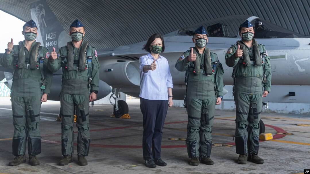 In this photo released by the Taiwan Ministry of National Defense, Taiwan's President Tsai Ing-wen is briefed during a visit to a naval station on Penghu, an archipelago of several dozen islands off Taiwan's western coast, Aug. 30, 2022.