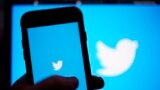 FILE: FILE - The Twitter application is seen on a digital device. A former head of security at Twitter has filed whistleblower complaints with U.S. officials alleging that the company misled regulators.