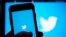 FILE: FILE - The Twitter application is seen on a digital device. A former head of security at Twitter has filed whistleblower complaints with U.S. officials alleging that the company misled regulators.