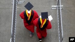 FILE - New graduates enter High Point Solutions Stadium prior to Rutgers University's graduation ceremony, in Piscataway Township, N.J., May 13, 2018. A U.S. Supreme Court associate justice has again declined to block President Joe Biden's plan to cancel billions in student debt.