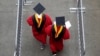 FILE - New graduates walk into the High Point Solutions Stadium before the start of the Rutgers University graduation ceremony, in Piscataway Township, New Jersey, May 13, 2018.