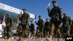 Taliban fighters march during a graduation ceremony after military training in Herat, Afghanistan, on Jan. 10, 2022. On Aug. 17, 2022, the Taliban said that their security forces killed a fugitive rebel commander in a shootout near the Iranian border.