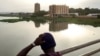 FILE - A boy looks at the city of Bamako from the Martyrs Bridge, on May 25, 2021. 