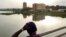 FILE - A boy looks at the city of Bamako from the Martyrs Bridge, on May 25, 2021. 