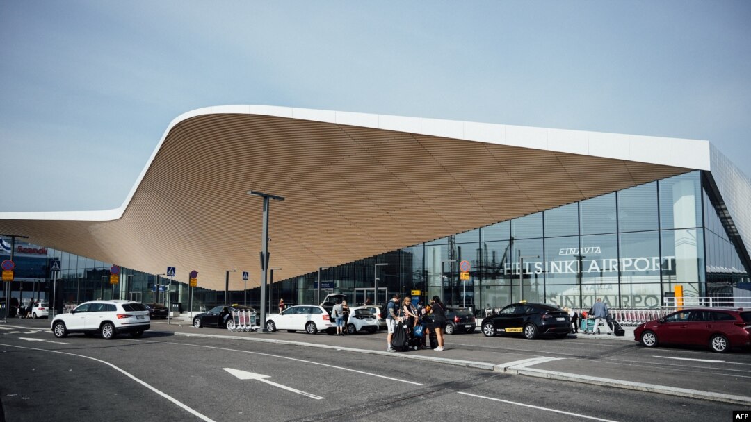 FILE - Cars and travelers are seen at the Helsinki airport in Vantaa, Finland, Aug. 19, 2022. Officials from Turkey, Finland and Sweden met in Vantaa on Aug. 26, 2022.