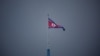 FILE - A North Korean flag flutters at the propaganda village of Gijungdong in North Korea, in this picture taken near the truce village of Panmunjom inside the demilitarized zone (DMZ) separating the two Koreas, South Korea, July 19, 2022. 