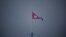 FILE - A North Korean flag flutters at the propaganda village of Gijungdong in North Korea, in this picture taken near the truce village of Panmunjom inside the demilitarized zone (DMZ) separating the two Koreas, South Korea, July 19, 2022. 
