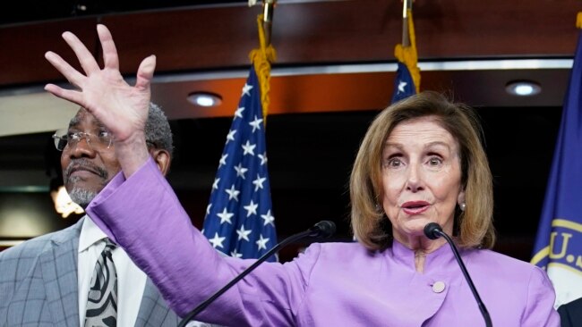 House Speaker Nancy Pelosi of California speaks as Rep. Gregory Meeks, D-N.Y., listens during a news conference on Capitol Hill, Aug. 10, 2022, in Washington.