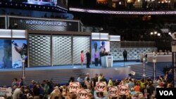 Delegates listen to speakers on the first night of the Democratic National Convention in Philadelphia