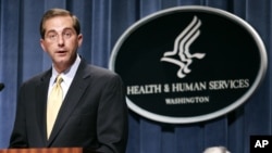 FILE - Then-Deputy Health and Human Services Secretary Alex Azar meets reporters at the HHS Department in Washington, June 8, 2006 to announce the approval of Gardasil, first vaccine developed to protect women against cervical cancer. 