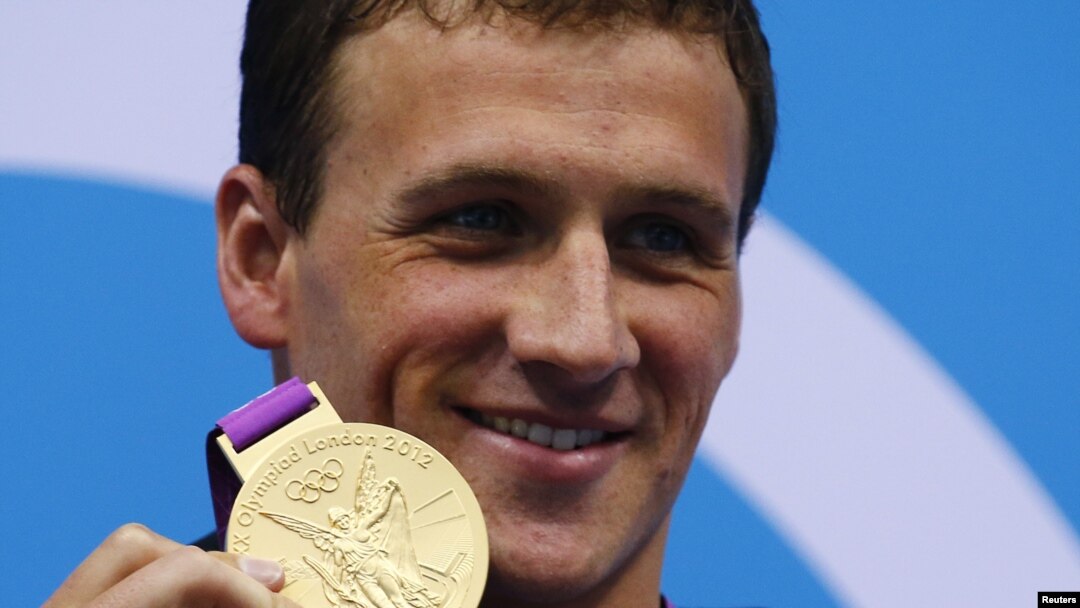 Ryan Lochte of the U.S. poses with his gold medal on the podium after winning the men's 400m individual medley final at the London 2012 Olympic Games at the Aquatics Centre July 28, 2012.