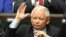 FILE - The leader of the ruling Law and Justice party, Jaroslaw Kaczynski, casts a vote in parliament in Warsaw, Poland, July 20, 2017.