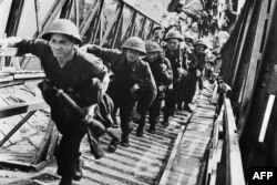 FILE - British soldiers of Allied forces are seen during D-Day landing operations in Normandy, France, early June, 1944.