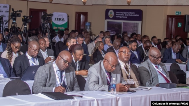 Delegates to the Zimbabwe-Zambia Energy Projects Summit in Victoria Falls, Zimbabwe, take notes on Nov. 19, 2024.