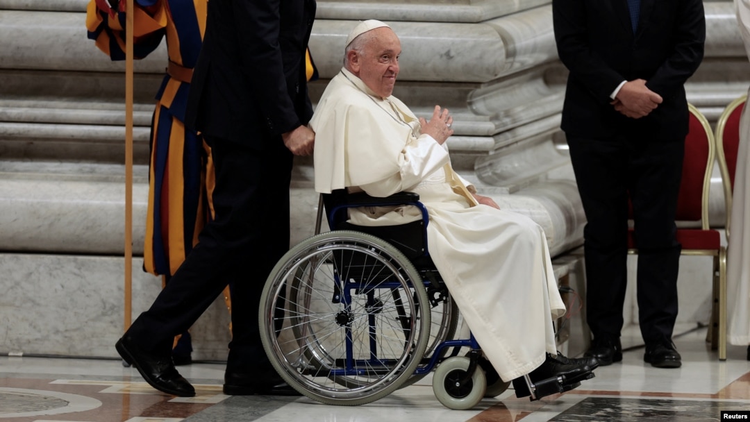 Pope Francis sits in a wheelchair as he leaves after presiding over a vigil, ahead of the Synod of bishops, at Saint Peter's church at the Vatican, Oct. 1, 2024. 