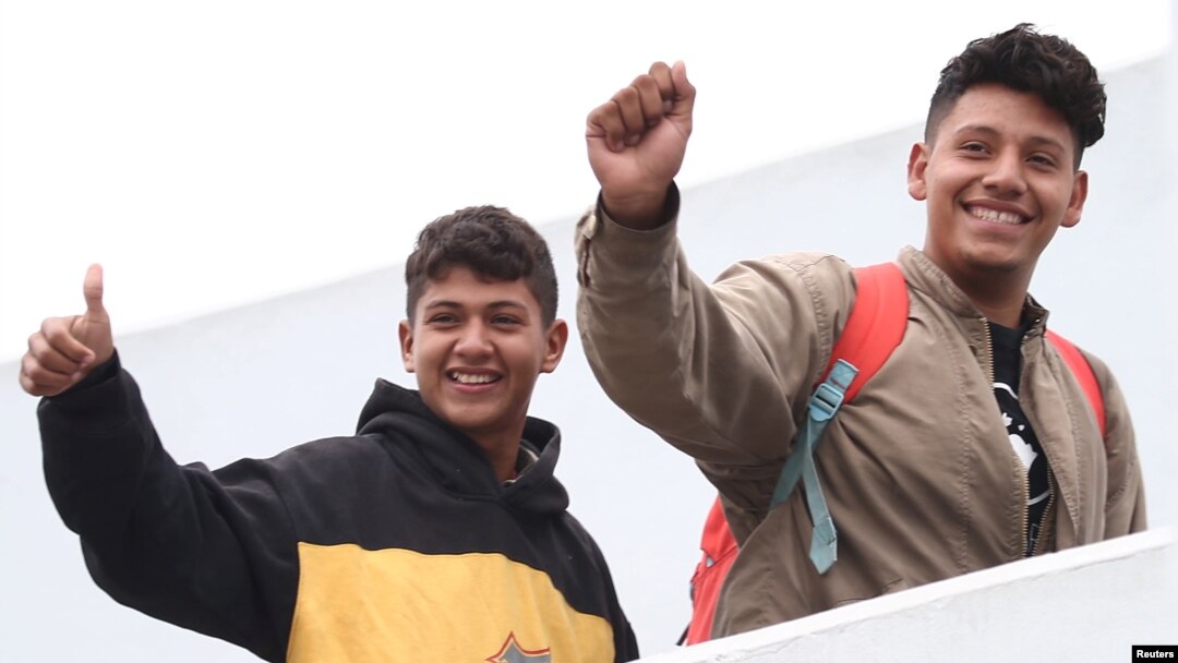 Members of a caravan of migrants from Central America enter the United States border and customs facility, where they are expected to apply for asylum, in Tijuana, Mexico, May 2, 2018.