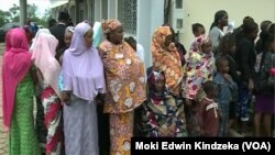 Internally displaced people line up to receive aid in Bamenda, April 3, 2019.