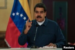 Venezuela's President Nicolas Maduro speaks during a meeting with ministers at the Miraflores Palace in Caracas, Venezuela, Aug. 13, 2018.