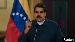 Venezuela's President Nicolas Maduro speaks during a meeting with ministers at the Miraflores Palace in Caracas, Venezuela, Aug. 13, 2018. 
