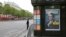 A police officer stands guard next to a newsstand displaying the cover of a news magazine depicting French president-elect Emmanuel Macron on the Champs Elyses avenue in Paris, France, May 8, 2017. 