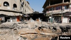 A crater made by an airstrike against Islamic State militants is Mosul, Iraq, Feb. 3, 2017.