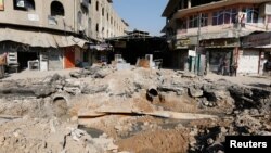 A crater made by an airstrike against Islamic State militants is seen in Mosul, Iraq, Feb. 3, 2017. 