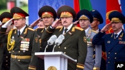 FILE - Belarus President Alexander Lukashenko, center, attends a military parade marking Independence Day in Minsk, Belarus, July 3, 2018.