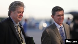 U.S. National Security Advisor Michael Flynn (R) and Senior Counselor Steve Bannon board Air Force One at West Palm Beach International airport in West Palm Beach, Florida, Feb. 12, 2017. 