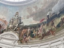 Frescoes on the ceiling of Bourse de Commerce, housing the Pinault Collection, depict colonial-era trade. (L. Bryant/VOA)