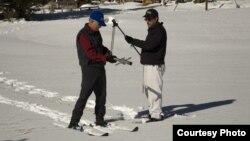 FILE - Frank Gehrke, right, Chief of California Cooperative Snow Surveys Program, measures snowpack in California’s Sierra Nevada Mountains.