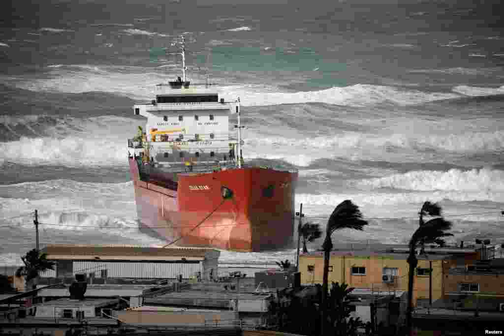 A cargo vessel is seen swept away by a storm in the Mediterranean Sea close to Ashdod&#39;s port in southern Israel.