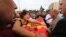 A relative cries over the coffin of Korkmaz Tedik, 25, killed in Saturday's bombing attacks, during his funeral, at the Pir Sultan Abdal Cemevi, a place of worship for Turkey’s Alevi community in the outskirts of Ankara, Turkey, Sunday, Oct. 11, 2015.