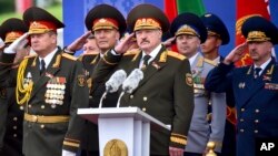 Belarus President Alexander Lukashenko, center, attends a military parade marking Independence Day in Minsk, Belarus, July 3, 2018. Several activists planning a protest rally to coincide with the parade were rounded up.