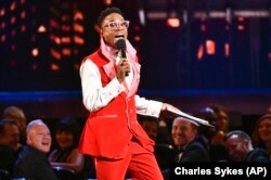 FILE - This June 9, 2019 file photo shows Billy Porter speaking at the Tony Awards in New York. Porter's outfit was made from curtains from the Tony Award-winning musical "Kinky Boots." He and other celebrities are wearing more vintage pieces.