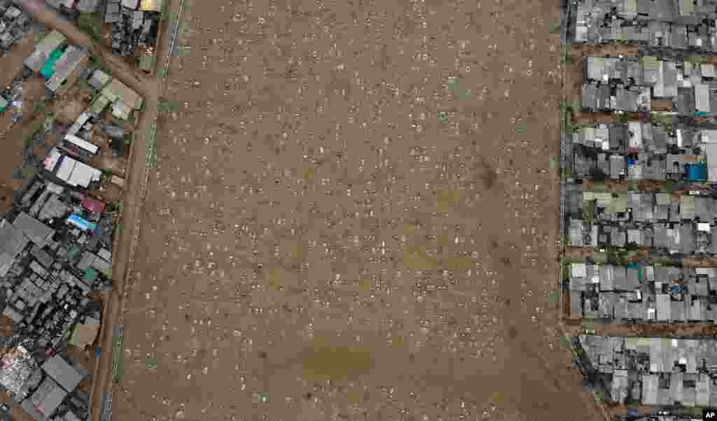 Graves dot the Cristo el Salvador cemetery at Villa el Salvador on the outskirts of Lima, Peru, amid the COVID-19 pandemic, June 30, 2020.