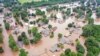 Flooded homes are seen along the Arkansas River in Sand Spring, Okla., in this May 28, 2019, aerial photo.