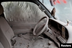 A car is seen covered in ash after the eruption of the Fuego volcano at San Miguel Los Lotes in Escuintla, Guatemala, June 10, 2018.