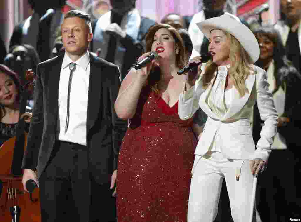Mary Lambert and Madonna perform "Same Love" by Ryan Lewis and Macklemore at the 56th annual Grammy Awards in Los Angeles, Jan. 26, 2014. 