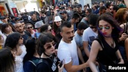 Riot police disperse LGBT rights activists as they try to gather for a pride parade, which was banned by the governorship, in central Istanbul, Turkey, June 25, 2017. 