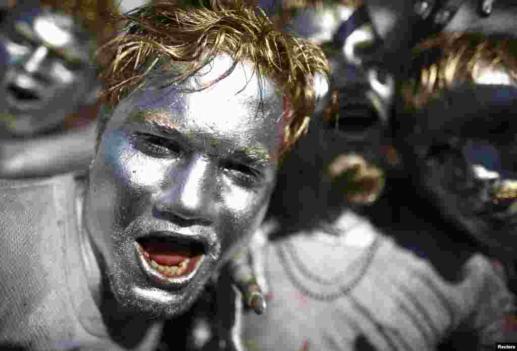 People sing and dance while celebrating Holi, the Festival of Colors, in Kathmandu, Nepal.