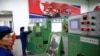 지난 5월 북한 평양의 326전선공장에서 직원들이 생산 설비를 조작하고 있다. (자료사진)
