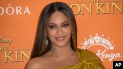 Beyonce poses for photographers upon arrival at the 'Lion King' European premiere in central London, Sunday, July 14, 2019. (Photo by Joel C Ryan/Invision/AP)