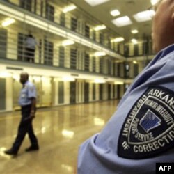 Guards patrol a cellblock at the Cummins Unit of the Arkansas Department of Correction in 2009