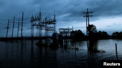 Floodwaters from Tropical Storm Harvey surround a power sub-station in Iowa, Calcasieu Parish, Louisiana, Aug. 29, 2017.