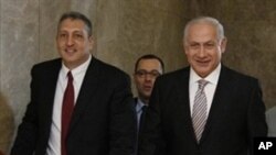 Israeli Prime Minister Benjamin Netanyahu, right, arrives to attend a cabinet meeting at his office in Jerusalem to rubber stamp the creation of an "independent public commission," to probe Israel's deadly naval raid on a Gaza-bound aid flotilla last mon